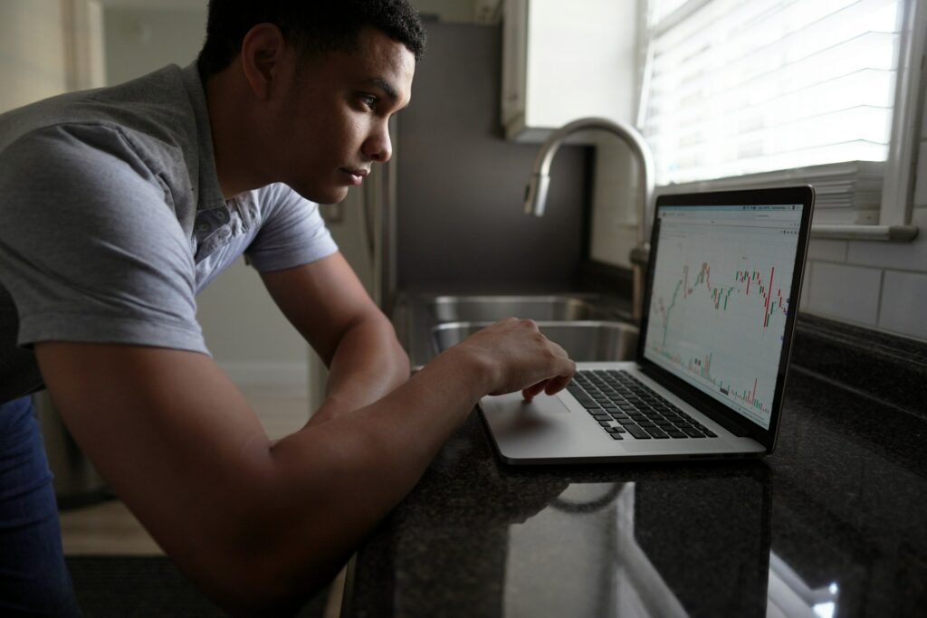 Man checking investment on a laptop