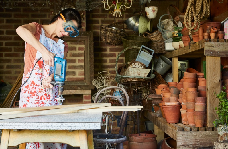 Woman doing a DIY project on a workshop