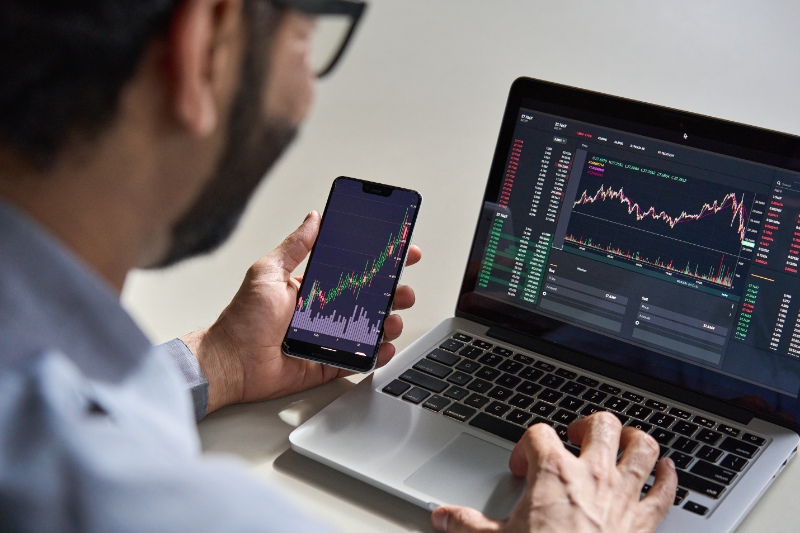 Man checking stock market grapgh 