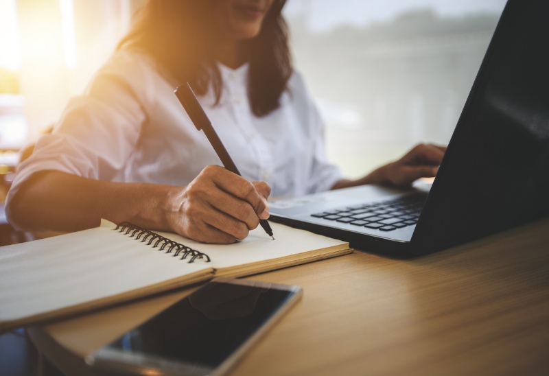 Woman studying using a laptop