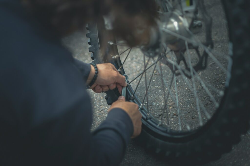 Man repairing a bicycle wheels