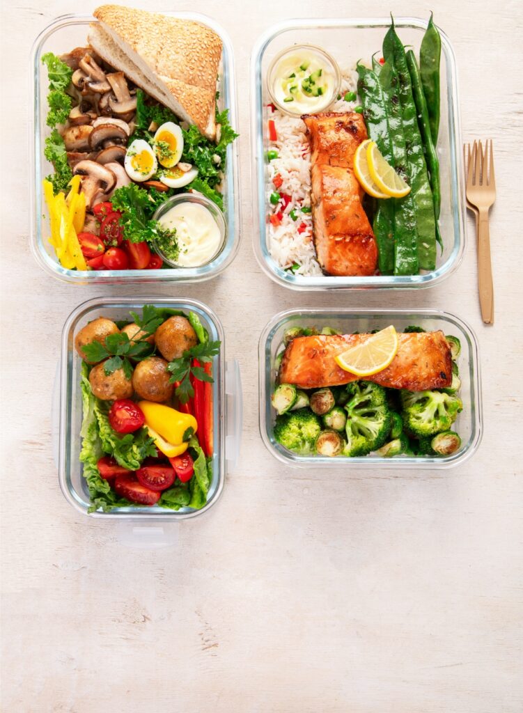 Top view of a healthy meal prep container filled with high-protein foods, showcasing a balanced and nutritious meal.