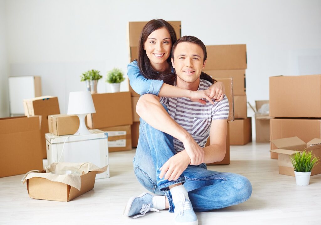 Couple moved in into a new home with boxes on the back